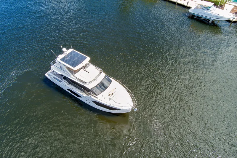 Joan's Rondevous Yacht Photos Pics Aerial view of 2025 Absolute 52 FLY yacht on calm water.