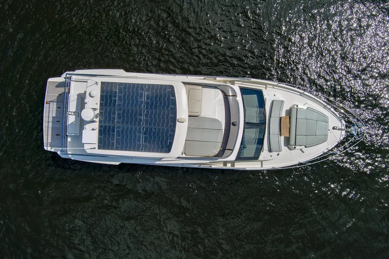 Joan's Rondevous Yacht Photos Pics Aerial view of 2025 Absolute 52 FLY yacht with solar panels on water.