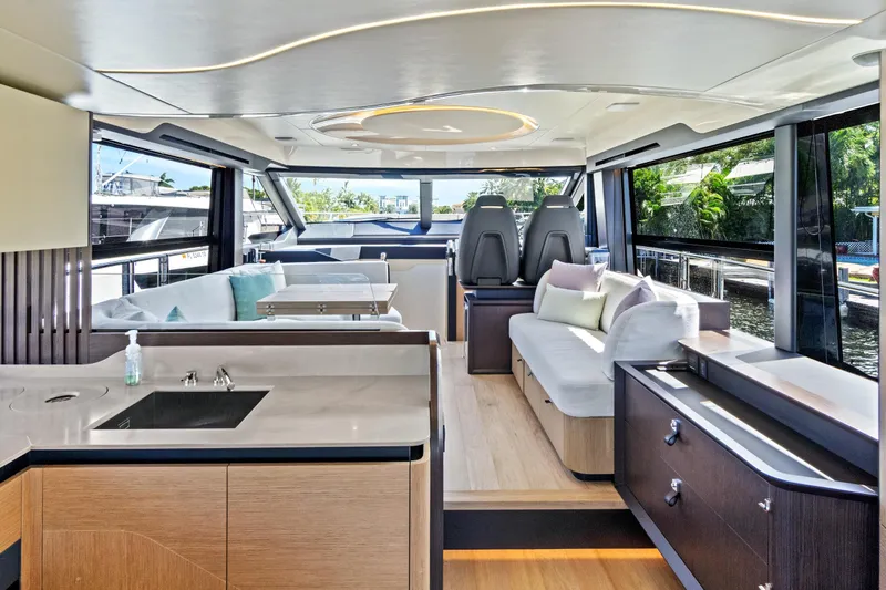 Joan's Rondevous Yacht Photos Pics Luxurious interior of 2025 Absolute 52 FLY yacht with modern design and spacious seating.
