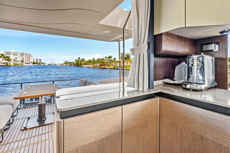 Joan's Rondevous Yacht Photos Pics Luxurious interior of 2025 Absolute 52 FLY yacht with scenic water view.