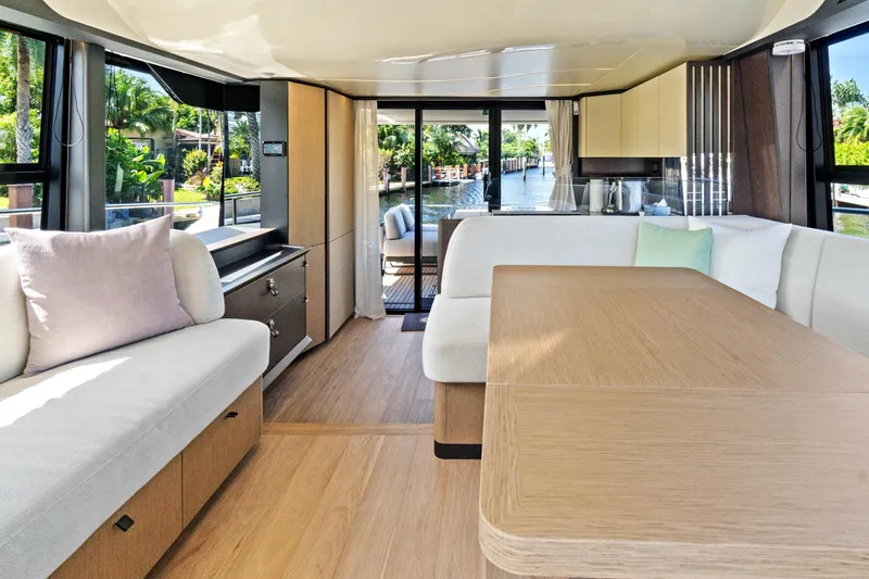 Joan's Rondevous Yacht Photos Pics Luxurious interior of 2025 Absolute 52 FLY yacht with modern furnishings and scenic views.