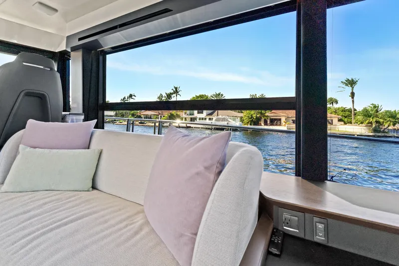 Joan's Rondevous Yacht Photos Pics Luxurious interior of 2025 Absolute 52 FLY yacht with waterfront view.