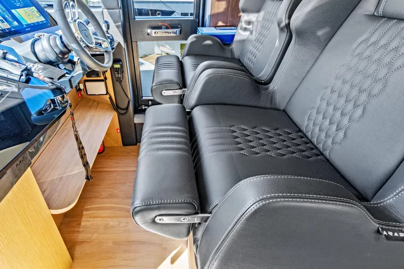 Joan's Rondevous Yacht Photos Pics Luxurious interior of 2025 Absolute 52 FLY yacht with leather seating and modern controls.