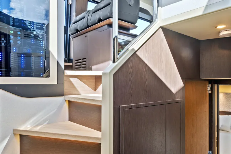 Joan's Rondevous Yacht Photos Pics Interior of 2025 Absolute 52 FLY yacht, featuring modern stairs and sleek design elements.