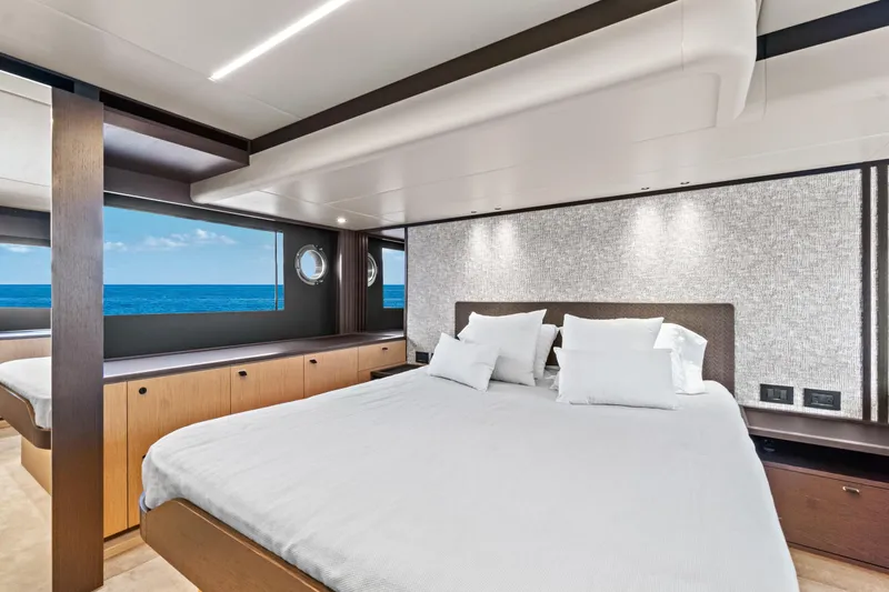 Joan's Rondevous Yacht Photos Pics Luxurious bedroom interior of 2025 Absolute 52 FLY yacht with ocean view.