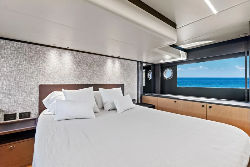 Joan's Rondevous Yacht Photos Pics Luxurious bedroom on 2025 Absolute 52 FLY yacht with ocean view.