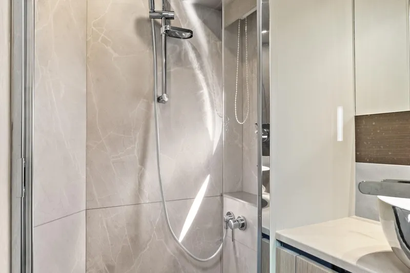 Joan's Rondevous Yacht Photos Pics Luxurious bathroom in 2025 Absolute 52 FLY yacht with modern shower design.