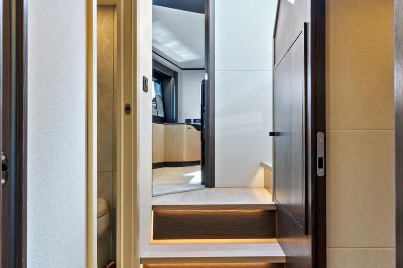 Joan's Rondevous Yacht Photos Pics Interior of 2025 Absolute 52 FLY yacht, featuring modern design and elegant lighting.