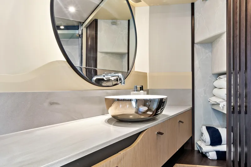 Joan's Rondevous Yacht Photos Pics Luxurious bathroom in 2025 Absolute 52 FLY yacht with modern sink and mirror.