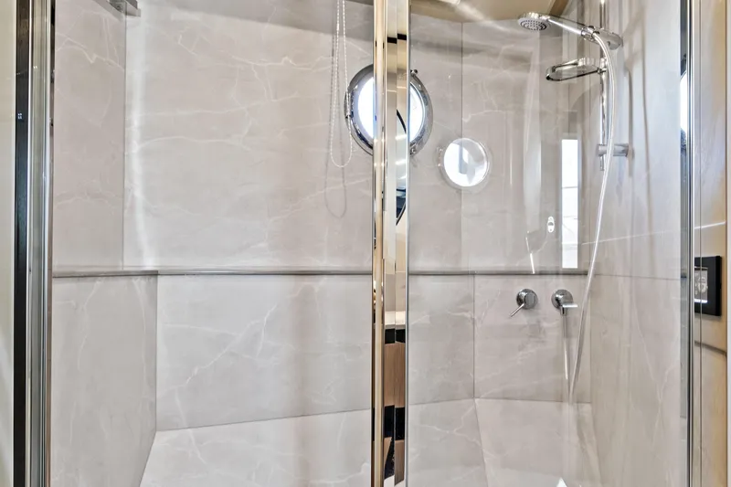 Joan's Rondevous Yacht Photos Pics Luxurious shower in 2025 Absolute 52 FLY yacht with modern fixtures and elegant design.