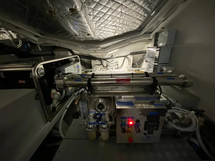  Yacht Photos Pics Engine room of 2020 Riva 66' Ribelle yacht, showcasing mechanical components and equipment.