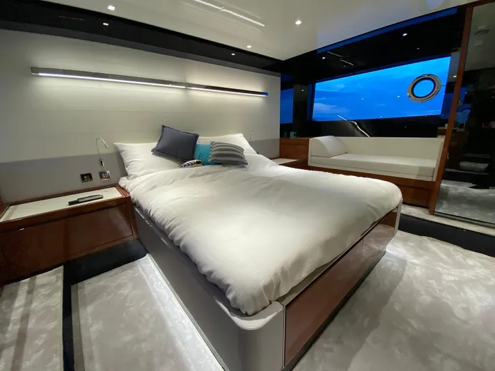  Yacht Photos Pics Luxurious bedroom interior of 2020 Riva 66' Ribelle yacht with modern design and ocean view.