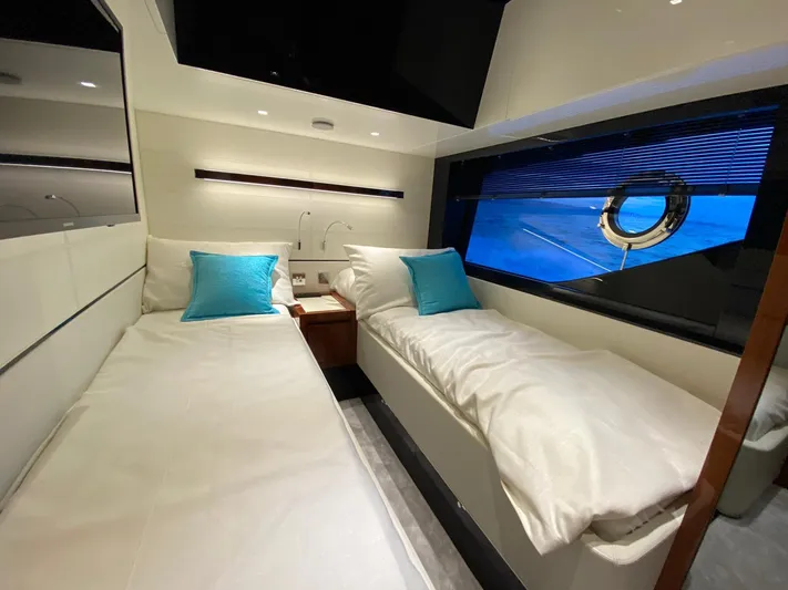  Yacht Photos Pics Luxurious twin cabin in 2020 Riva 66' Ribelle yacht with blue accents.