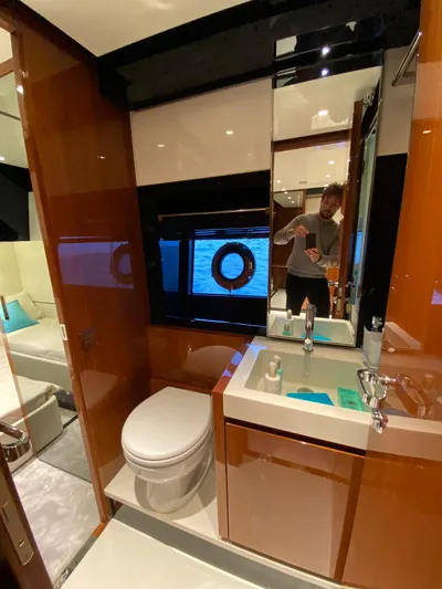  Yacht Photos Pics Luxurious bathroom interior of 2020 Riva 66' Ribelle yacht with modern fixtures.
