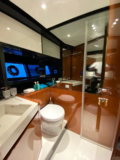  Yacht Photos Pics Luxurious bathroom in 2020 Riva 66' Ribelle yacht with modern fixtures and sleek design.
