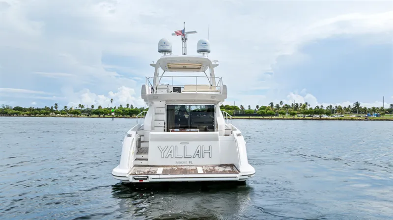  Yacht Photos Pics Azimut 54 Flybridge 2016 yacht on water, rear view with "YALLAH" name.