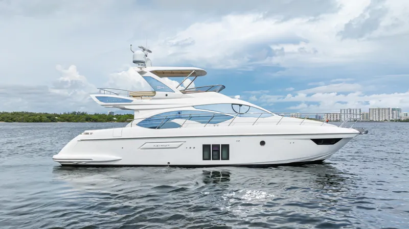  Yacht Photos Pics 2016 Azimut 54 Flybridge yacht on calm water with cloudy sky.