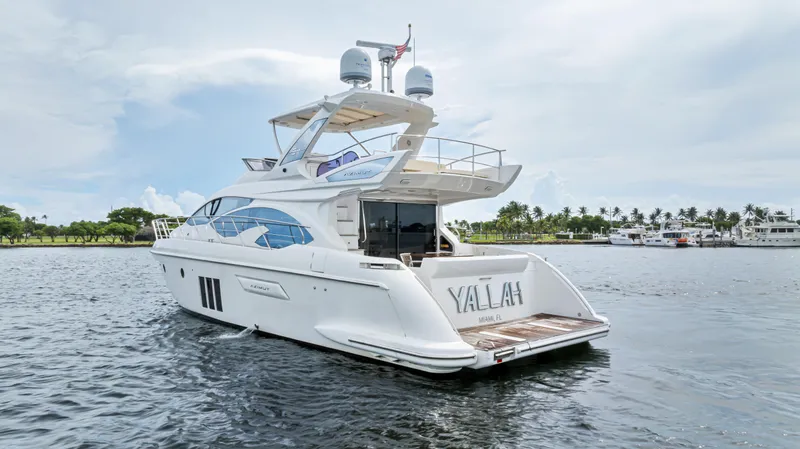  Yacht Photos Pics Azimut 54 Flybridge 2016 yacht on water, rear view with open deck.
