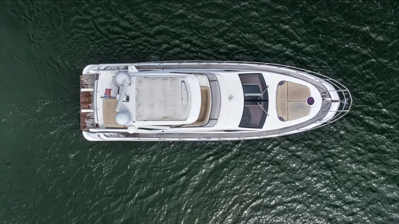  Yacht Photos Pics Aerial view of 2016 Azimut 54 Flybridge yacht on water.