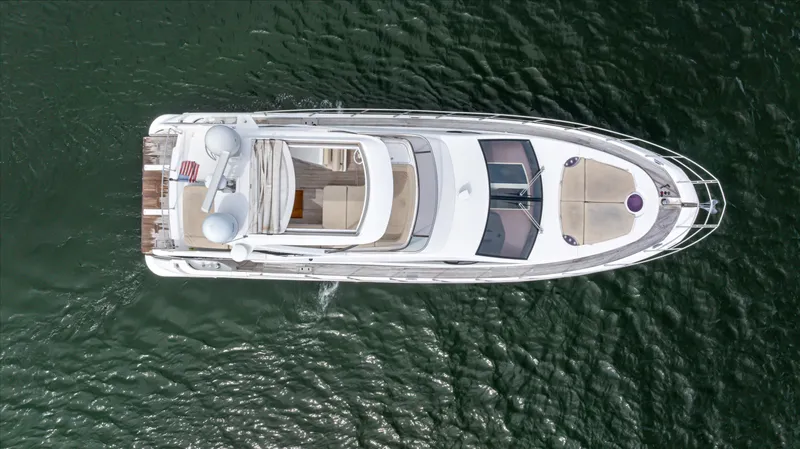  Yacht Photos Pics Aerial view of 2016 Azimut 54 Flybridge yacht on open water.