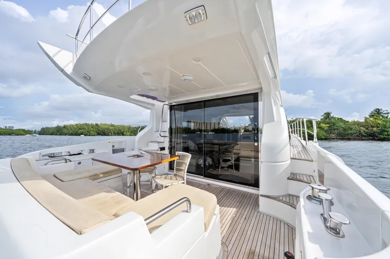  Yacht Photos Pics Luxurious 2016 Azimut 54 Flybridge yacht with spacious deck and elegant seating area.