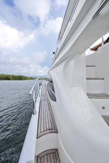  Yacht Photos Pics Side view of 2016 Azimut 54 Flybridge yacht on calm water.