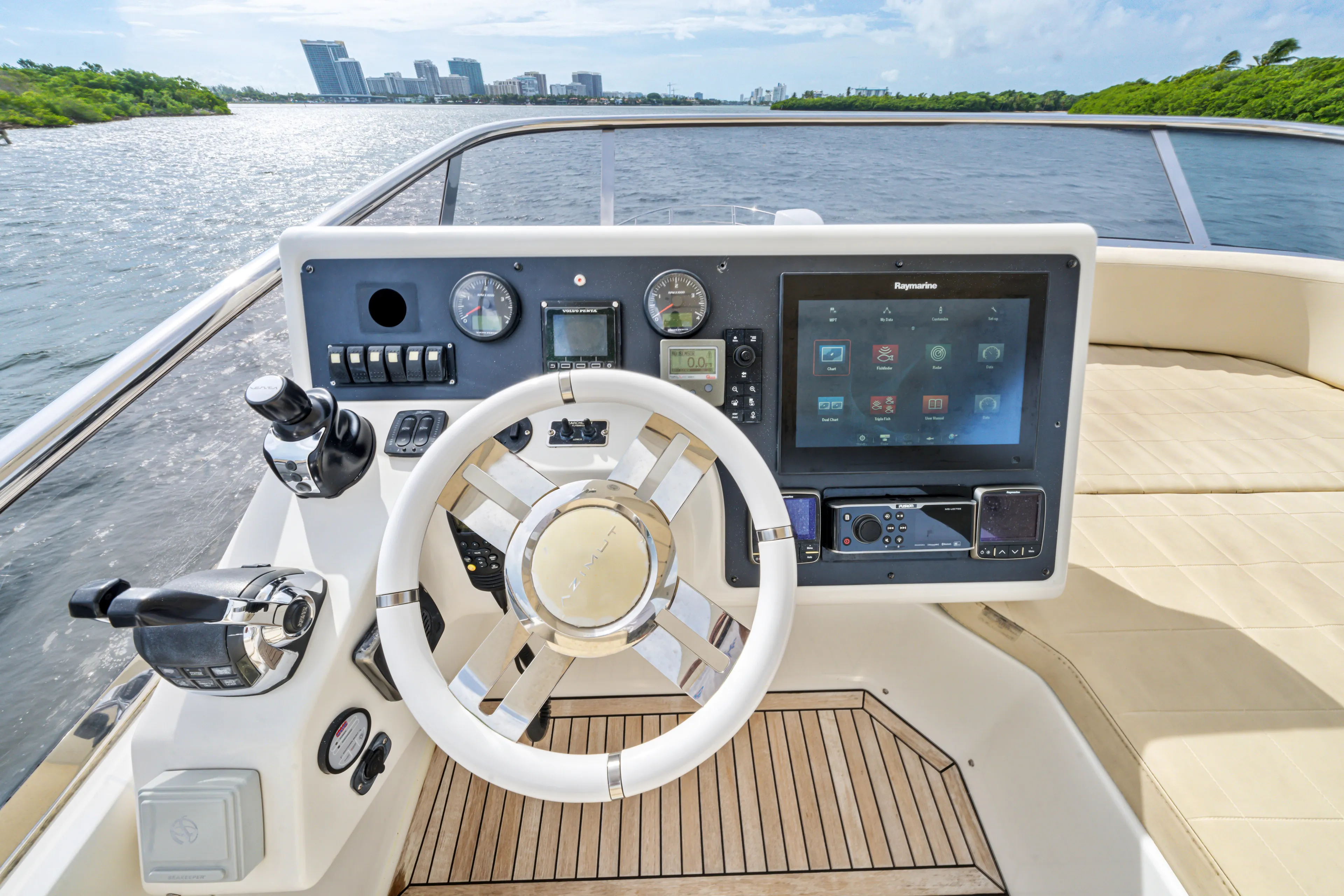  Yacht Photos Pics Helm of 2016 Azimut 54 Flybridge yacht with modern navigation controls.