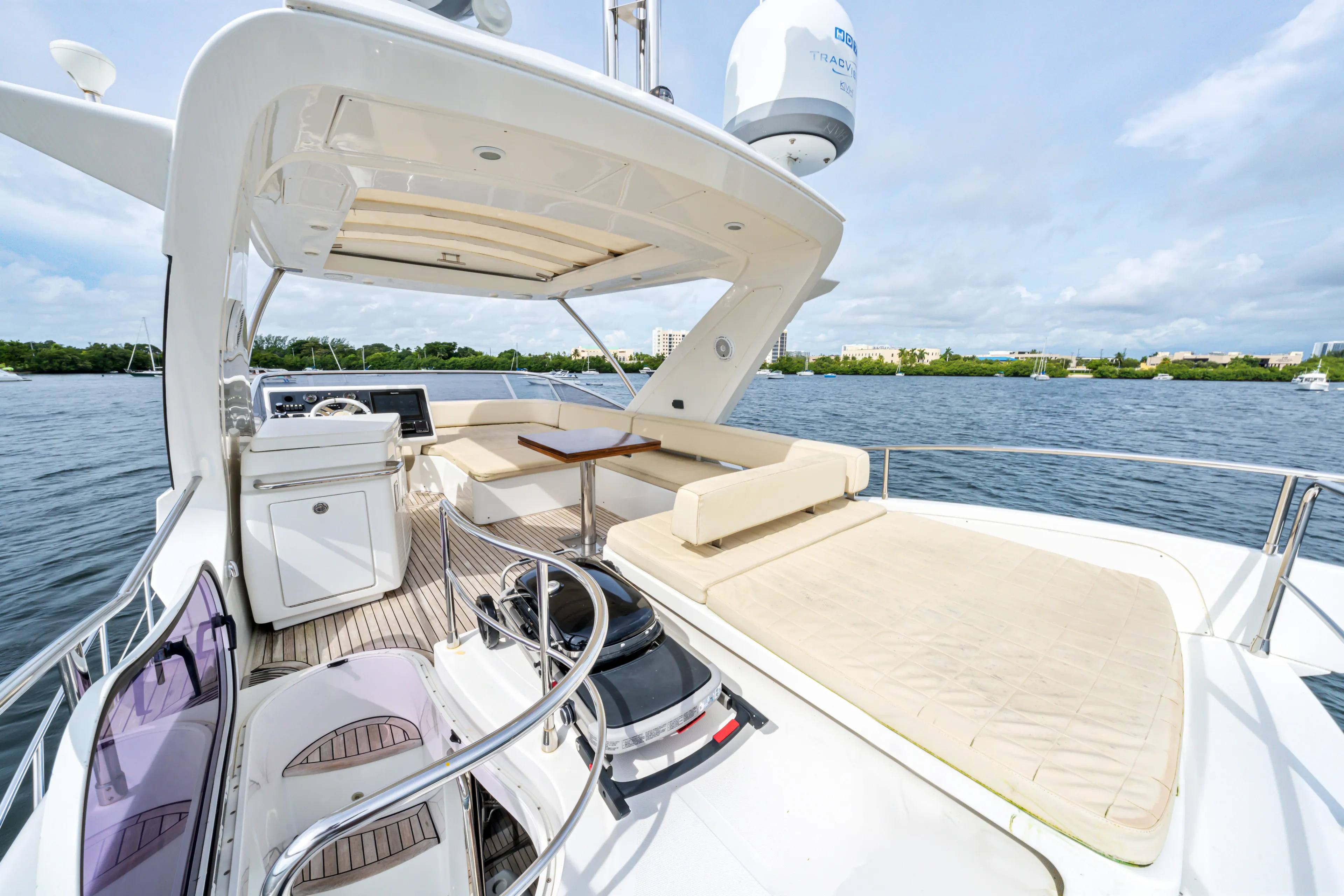  Yacht Photos Pics Luxurious 2016 Azimut 54 Flybridge yacht with spacious deck and seating area on the water.
