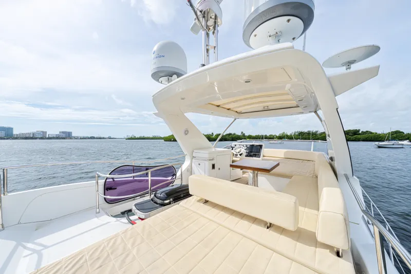  Yacht Photos Pics Luxurious 2016 Azimut 54 Flybridge yacht with spacious deck and scenic water view.
