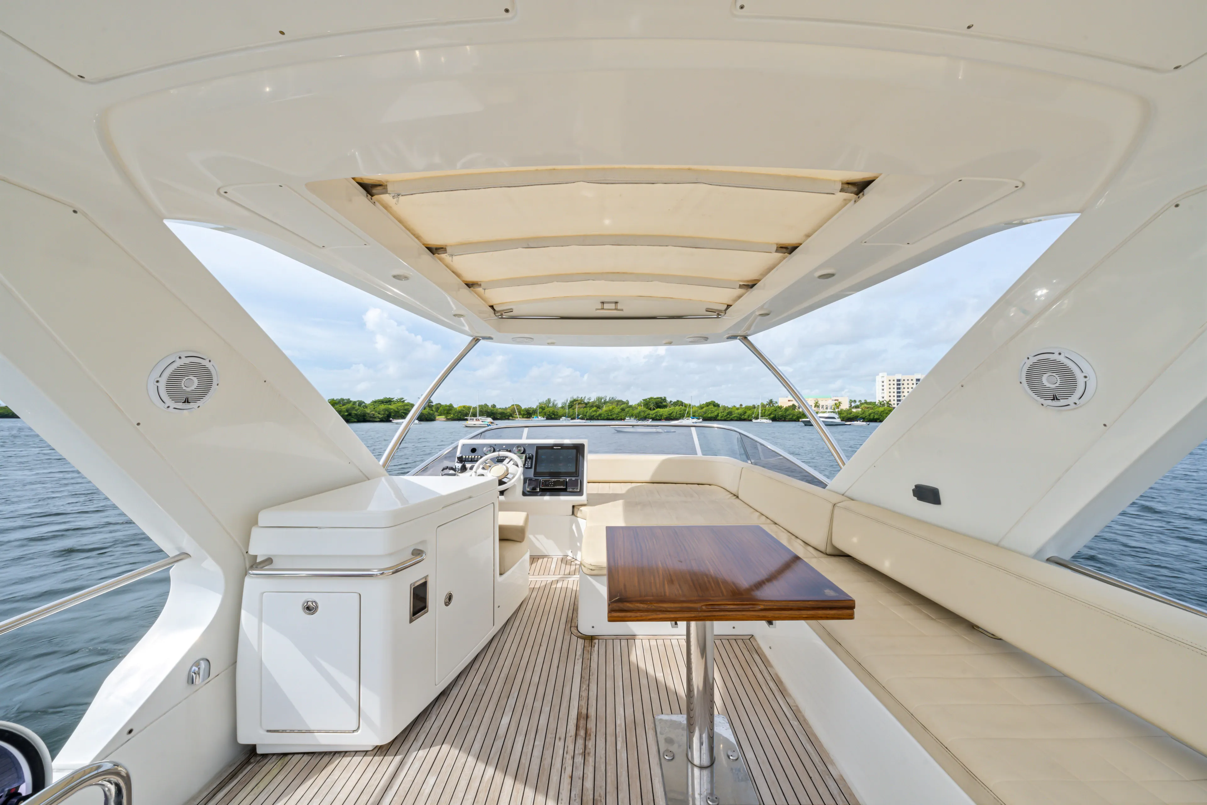  Yacht Photos Pics Luxurious 2016 Azimut 54 Flybridge yacht interior with seating and table on open deck.