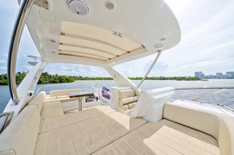  Yacht Photos Pics Luxurious 2016 Azimut 54 Flybridge yacht with spacious seating and scenic water views.