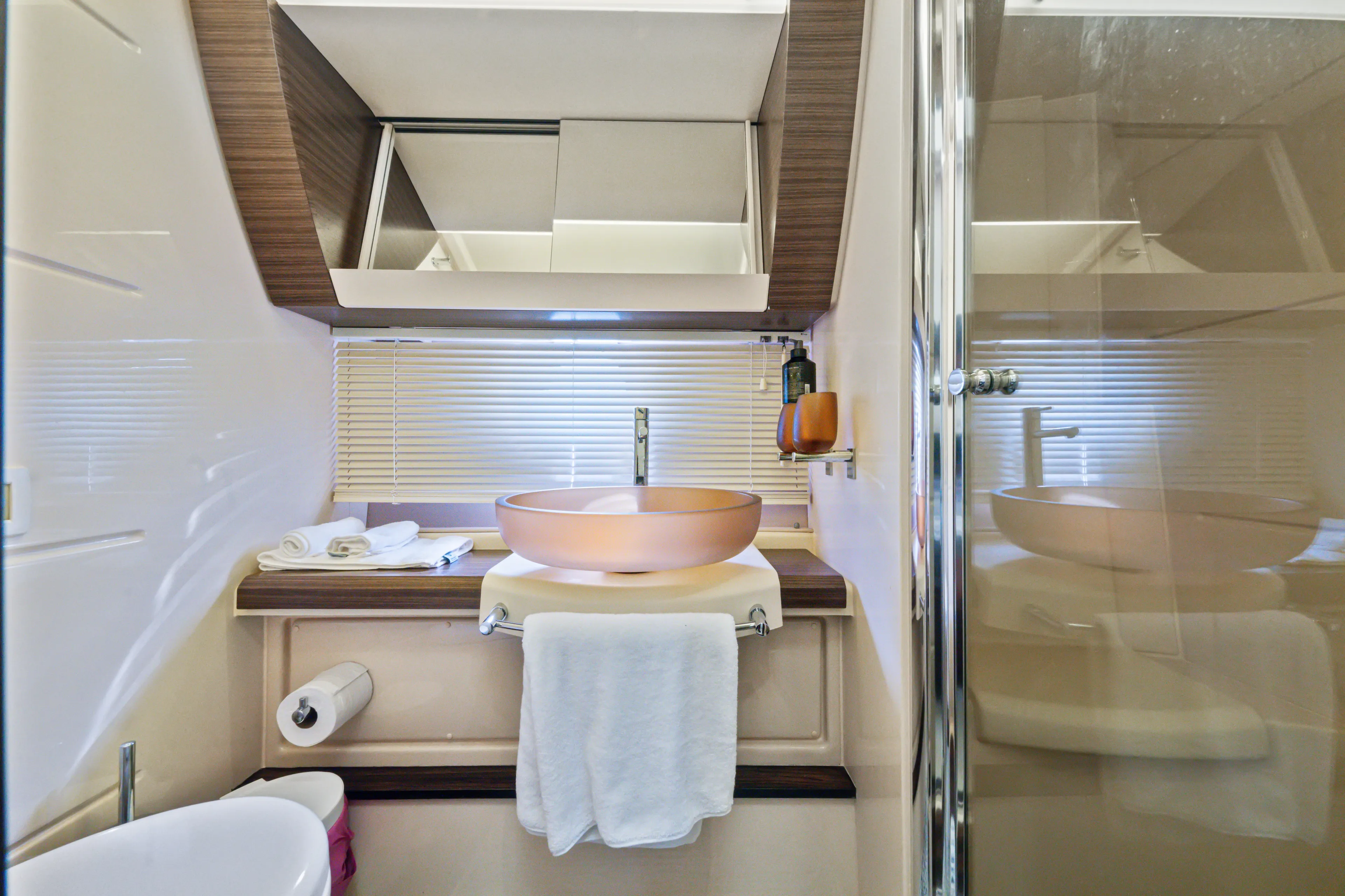  Yacht Photos Pics Luxurious bathroom in 2016 Azimut 54 Flybridge yacht with modern fixtures and elegant design.