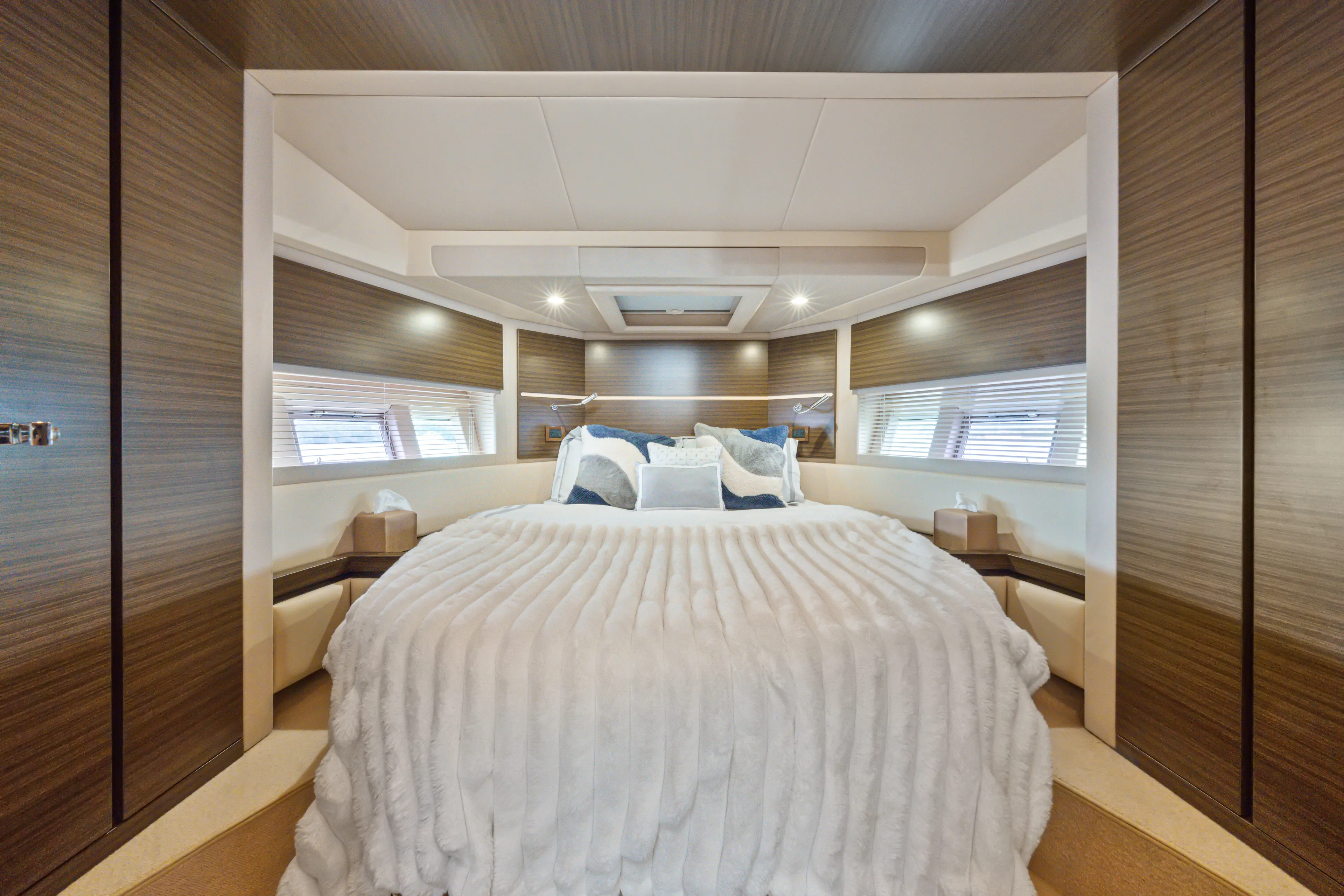  Yacht Photos Pics Luxurious bedroom interior of 2016 Azimut 54 Flybridge yacht with elegant design.