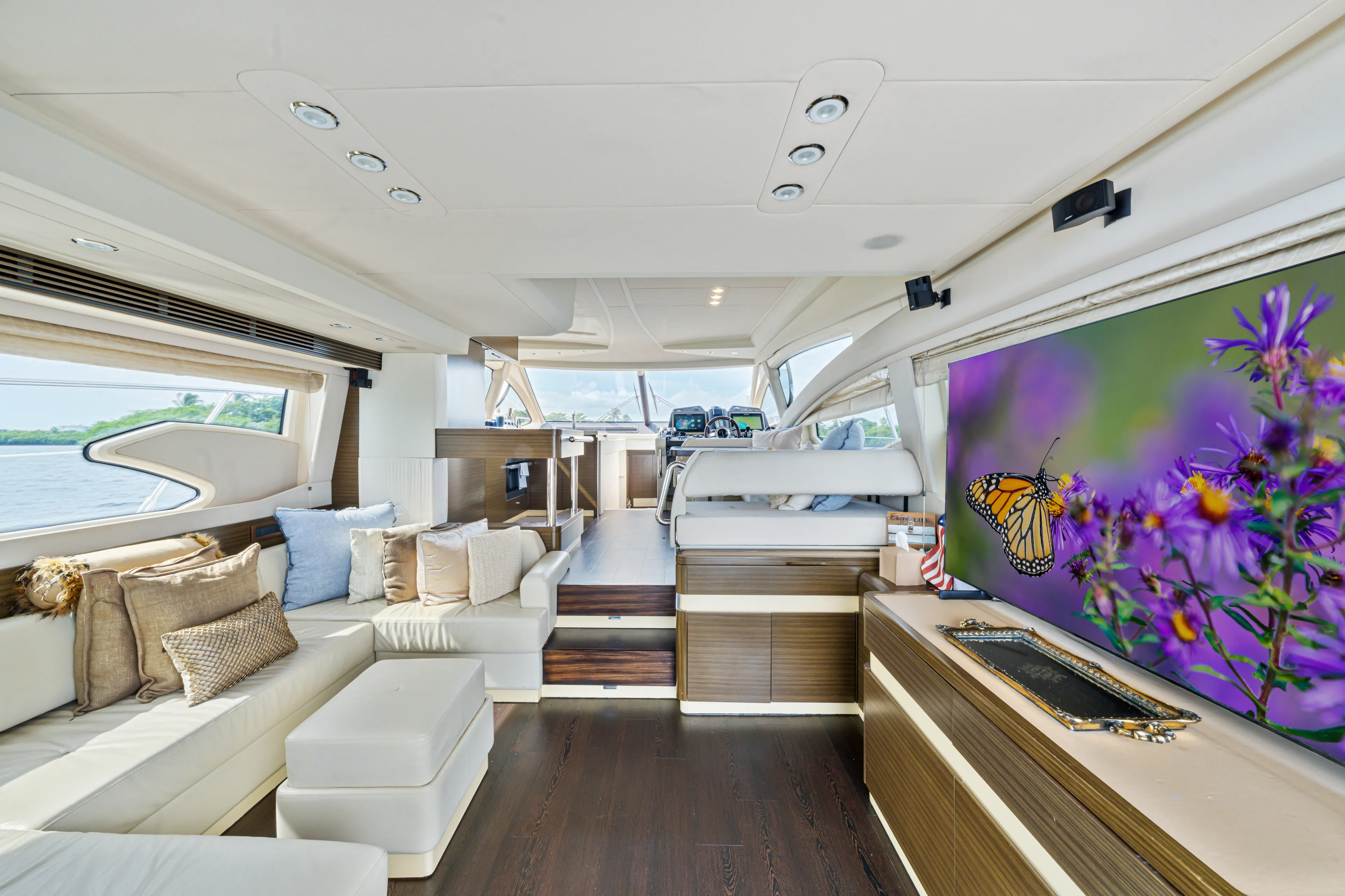  Yacht Photos Pics Luxurious interior of 2016 Azimut 54 Flybridge yacht with elegant seating and vibrant artwork.