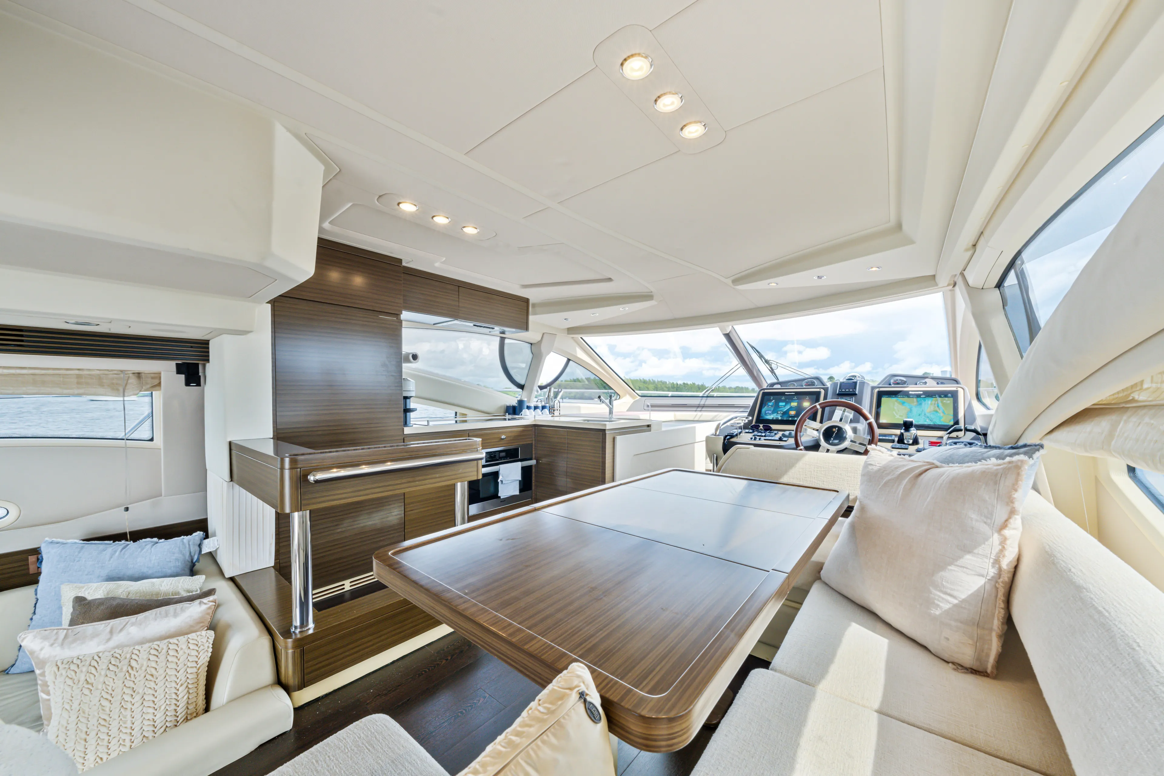  Yacht Photos Pics Luxurious interior of 2016 Azimut 54 Flybridge yacht with elegant seating and modern helm.
