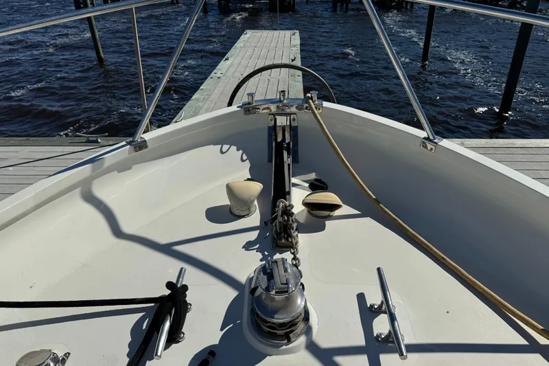  Yacht Photos Pics Bow of 1989 Seaton Trawler docked, featuring anchor and railing.