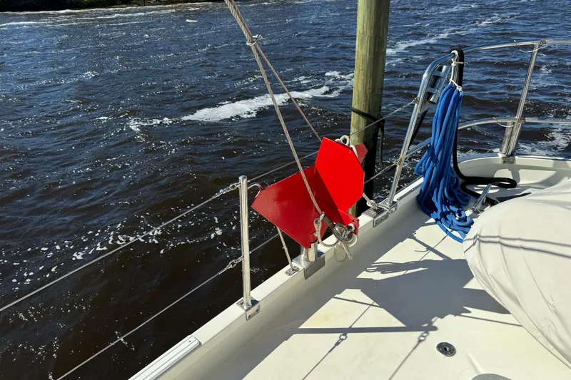  Yacht Photos Pics 1989 Seaton Trawler deck with red anchor and blue rope by the water.