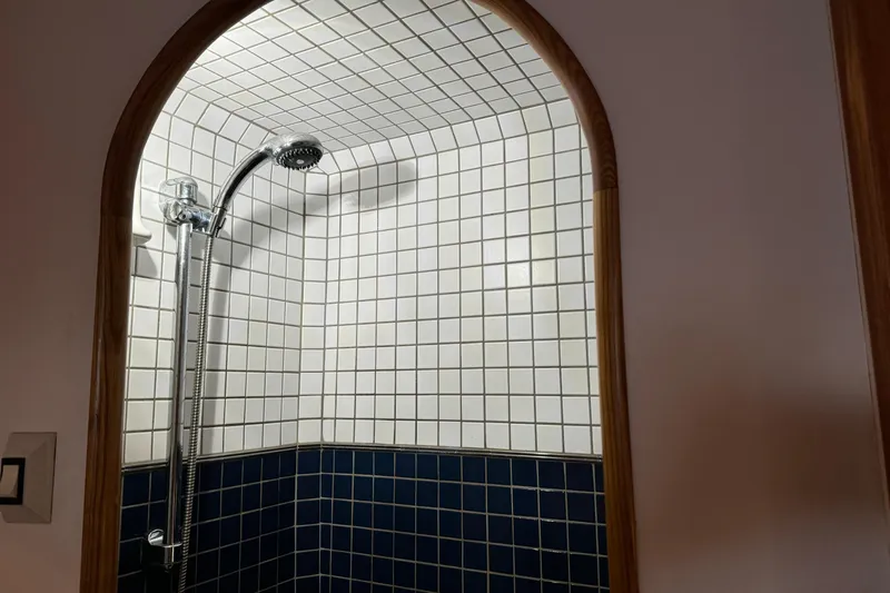  Yacht Photos Pics Arched shower with white and blue tiles on a 1989 Seaton Trawler.