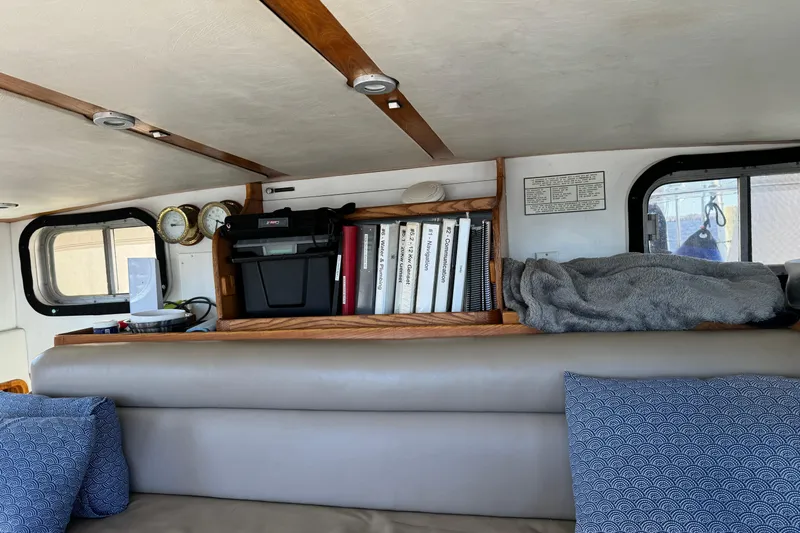  Yacht Photos Pics Interior of 1989 Seaton Trawler with books, gauges, and cozy seating area.