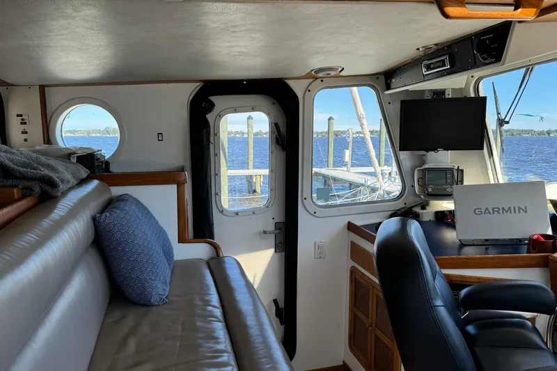  Yacht Photos Pics Interior of a 1989 Seaton Trawler with leather seating and navigation equipment.