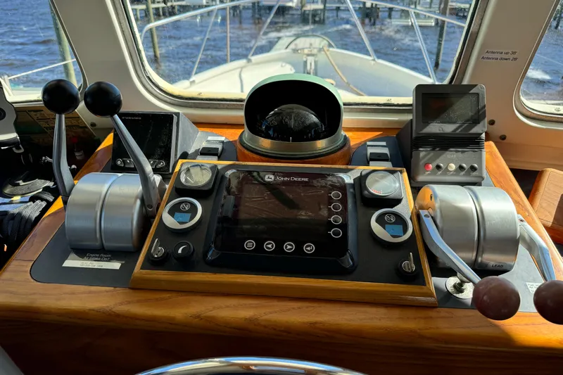  Yacht Photos Pics Control panel of a 1989 Seaton Trawler with navigation and throttle controls.