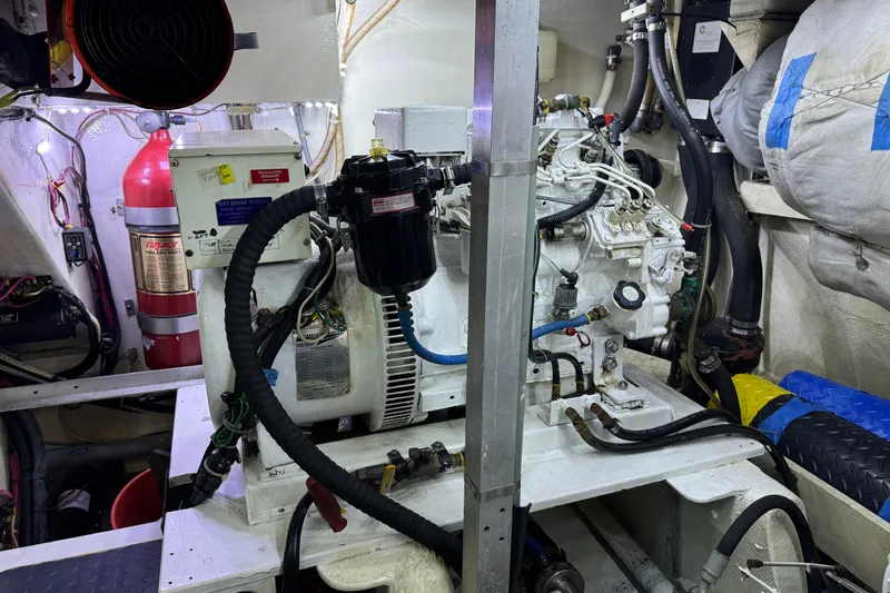 Yacht Photos Pics Engine room of a 1989 Seaton Trawler with visible machinery and fire extinguisher.