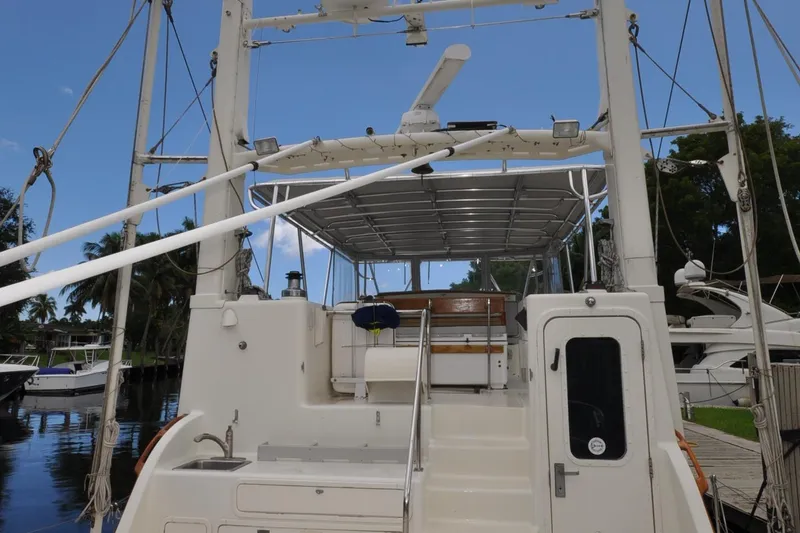  Yacht Photos Pics 1989 Seaton Trawler yacht docked, featuring upper deck and outdoor seating area.