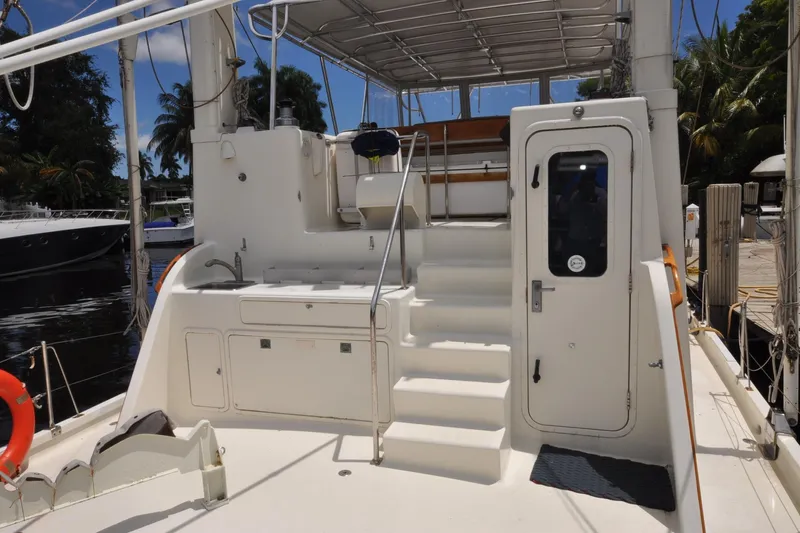  Yacht Photos Pics 1989 Seaton Trawler boat deck with stairs, door, and outdoor sink.