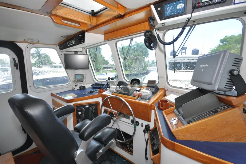  Yacht Photos Pics 1989 Seaton Trawler helm with navigation equipment and captain's chair.