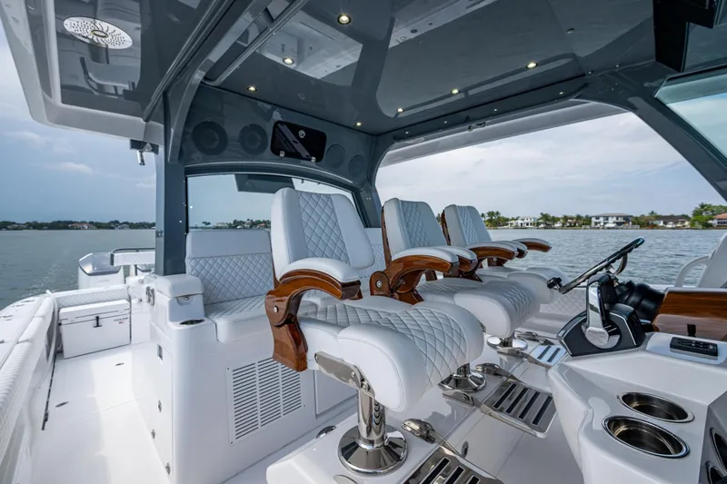  Yacht Photos Pics Luxurious interior of 2025 HCB 48 Campeon boat with plush seating and modern design.