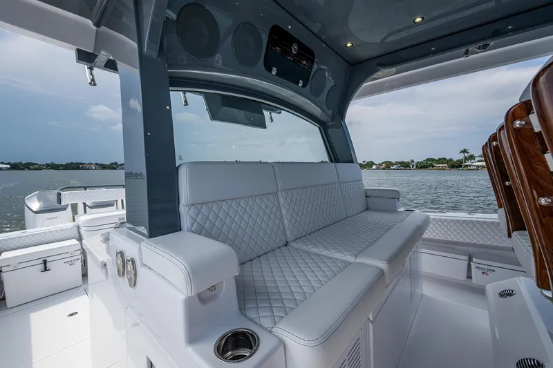  Yacht Photos Pics Luxurious seating on 2025 HCB 48 Campeon boat with quilted upholstery and scenic water view.
