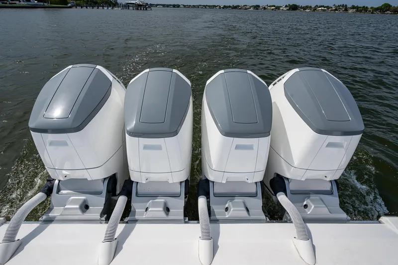  Yacht Photos Pics Four powerful outboard engines on a 2025 HCB 48 Campeon boat, cruising on open water.