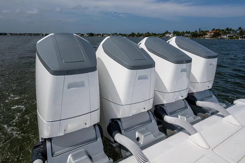  Yacht Photos Pics Four powerful outboard engines on a 2025 HCB 48 Campeon boat, cruising on open water.