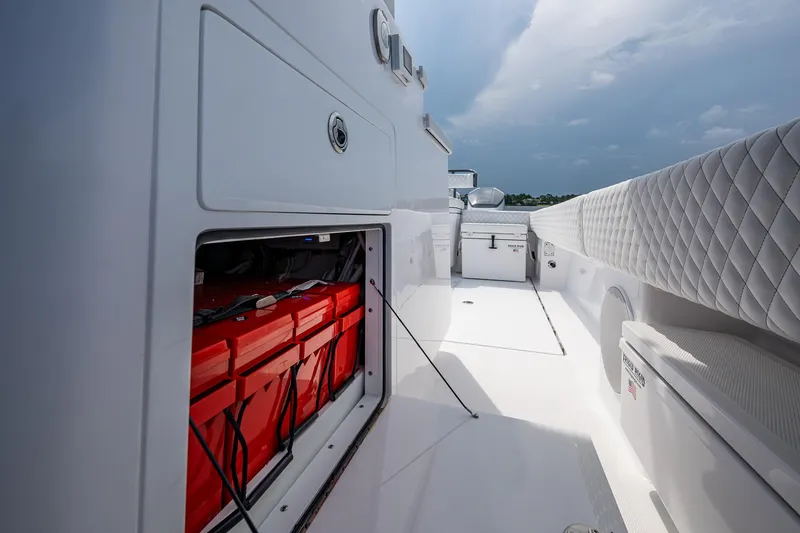  Yacht Photos Pics 2025 HCB 48 Campeon boat interior with open storage compartment and quilted seating.